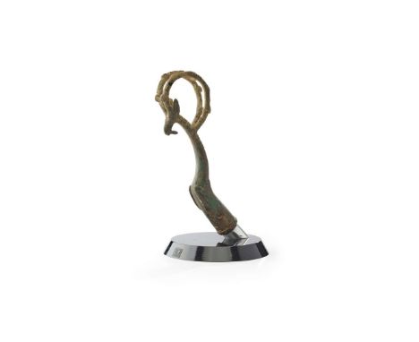  LURISTAN BRONZE WHETSTONE HANDLE WESTERN ASIA, 700-900 B. C. in the form of a jumping ibex, its legs tucked close to its bod