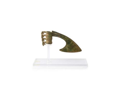  LURISTAN BRONZE AXE HEAD WESTERN ASIA, 800-900 B. C. the flaring and downward-curving blade with thick edges and a ribbed tu