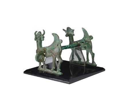  LURISTAN HORSE BIT WESTERN ASIA, 800 – 600 B.C. cast bronze, consisting of a rigid mouthpiece and a pair of cheek pieces for