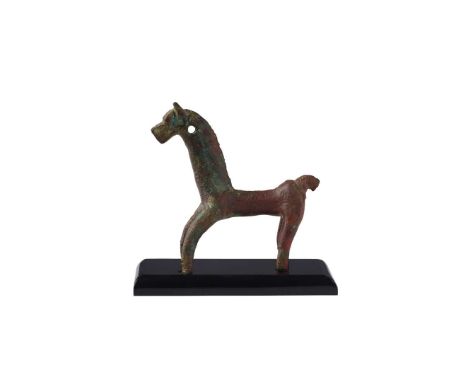  LURISTAN BRONZE HORSE WESTERN ASIA, 800 – 600 B.C. cast bronze, the standing animal reduced to the essence of form, shown st