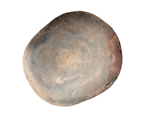  AFRICAN NEOLITHIC GRAIN GRINDING MILL CENTRAL SAHARA, C. 4TH – 3RD MILLENNIUM B.C. carved stone, well patinated surface work