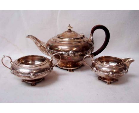 An Art Deco silver three-piece tea service by Cooper Brothers and Sons, compressed form, Celtic inspired girdle, loop handles