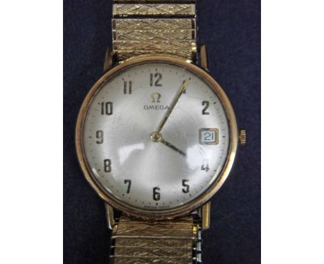 An Omega Gentleman's Wrist Watch, 9ct gold case, 31mm diameter, silvered dial with raised gilt Arabic numerals, Omega cypher,