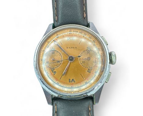 A 1950s gentleman's chronograph wrist watch, signed Elida. Featuring a rose metal coloured dial, with two subsidiary dials, t