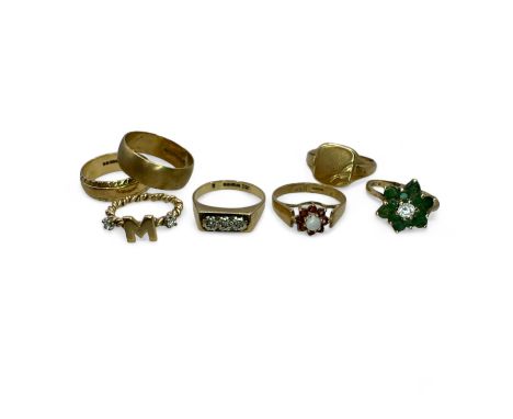 A group of seven 9ct gold rings.&nbsp;
To include hallmarked gold rings: two band rings, size O &amp; M; a thee stone diamond