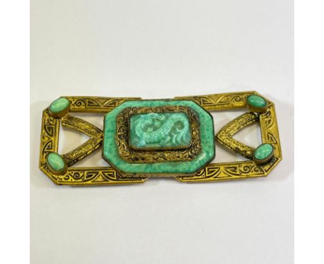 A Czechoslovakian buckle with central jade effect dragon design. 7cm x 1cm x 3cm.  Condition: 2 small chips - one to Dragons 