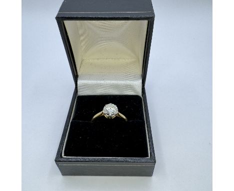  A diamond solitaire ring set with a calculated 0.80 carat round brilliant cut diamond. Set into a white and yellow precious 