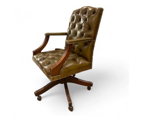 A green leather button back office chair, some small wear but a good colour and patina