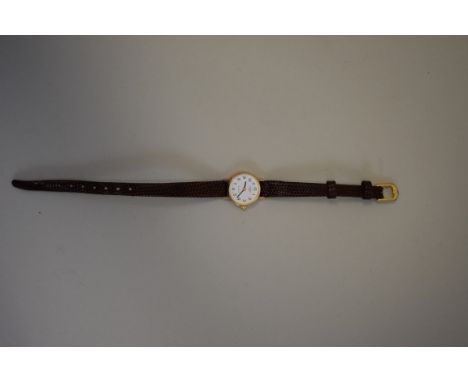 A boxed Rotary 9ct gold ladies wristwatch, on leather strap, with receipt dated 1988. 