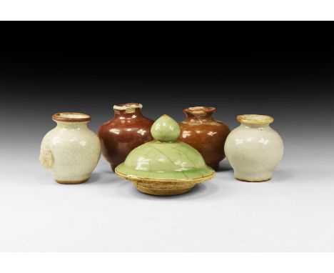 Ming Dynasty, 1368-1644 AD. A mixed group comprising four ceramic glazed pots, each with flat rim, short neck, globular body 
