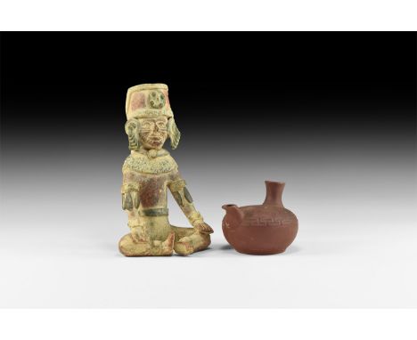 A pair of undated archaistic ceramic items consisting of: a feeding bottle with tall funnel to the back, small spout to the f