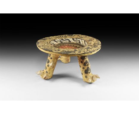 An undated archaistic pre-columbian style tripod bowl; three legs with dappled pattern terminating in a clawed foot; bowl wit