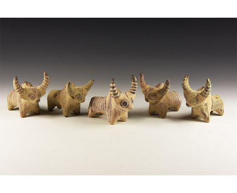 3rd millennium BC. A group of five ceramic zebu figures with painted linear detailing.  546 grams total, 89-93mm (3 1/2 - 3 3