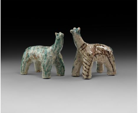 A pair of undated archaistic glazed ceramic animal figures.  835 grams total, 14cm (5 1/4"). Property of a London gentleman; 