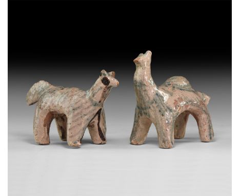 A pair of undated archaistic glazed ceramic animal figures, one with dorsal hump.  534 grams total, 12-14cm (4 3/4 - 5 1/2").