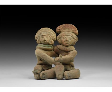 A conjoined pair of undated archaistic ceramic seated figures, with inner arms around the shoulders and outer arms joined tog