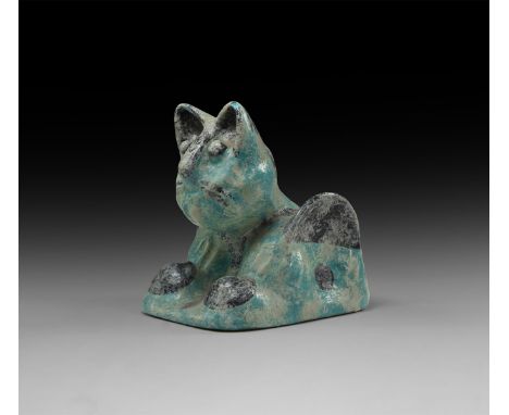 An undated archaistic blue-glazed ceramic cat figure with flange hips and pellet eyes.  680 grams, 14cm (5 1/4"). Property of
