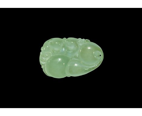 19th-20th century AD. A pale green translucent oval jade pendant, engraved with a dragon, head turned to look back, reclining