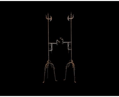 20th century AD. A matched pair of wrought iron stands each with tripod legs and leaf-scroll detailing, round-section shaft w