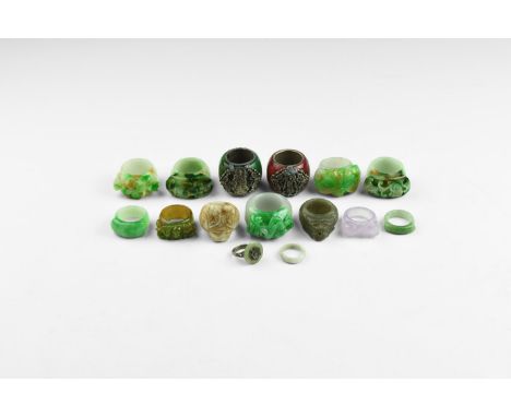 19th-20th century AD. A mixed group of jade finger rings including plain hoops, plain hoops with zoomorphic bezel, plain hoop