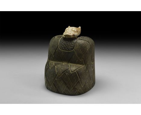 An undated archaistic carved stone idol with hatched feather cloak, separate feline head.  4.2 kg, 17cm (6 3/4"). Property of
