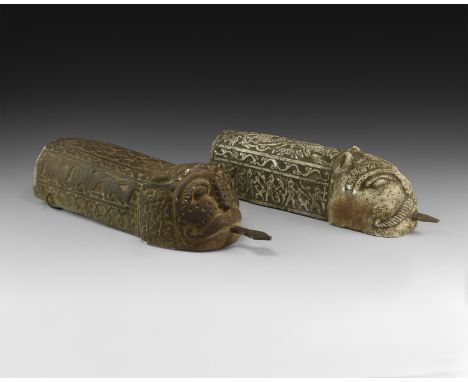 Early 20th century AD. A matched pair of stone architectural channel covers each with lion-head detailing, inset iron tongue 