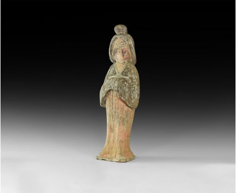 An undated archaistic large ceramic figure of a female with plump face, elaborate hairstyle pulled up into a bun to the front