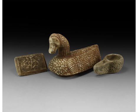 A mixed group of undated archaistic stone items comprising an oil lamp with long slender nozzle, a stamp seal with seated fig