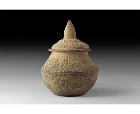 An undated archaistic ceramic jar with carinated shoulder and rolled rim, domed lid with spiral spike handle, reserved bands 