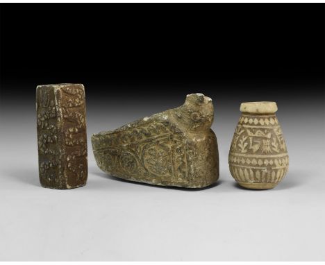 Group comprising undated archaistic carved pieces: a slipper-shaped oil lamp with floriate decoration to sides; a small vesse
