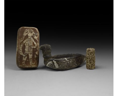 A mixed group of undated archaistic stone items comprising a figural cylinder seal, a figural stamp seal and an oil lamp.  1 