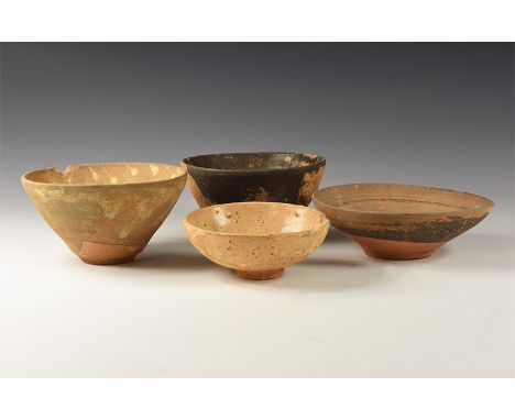 Song Dynasty, 960-1127 AD. A mixed group of four ceramic bowls and dishes, each with a basal ring.  581 grams total, 9-12cm (