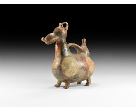 An undated archaistic glazed Peruvian style ceramic stirrup vase formed as a canine with rounded body, stub legs, strap handl