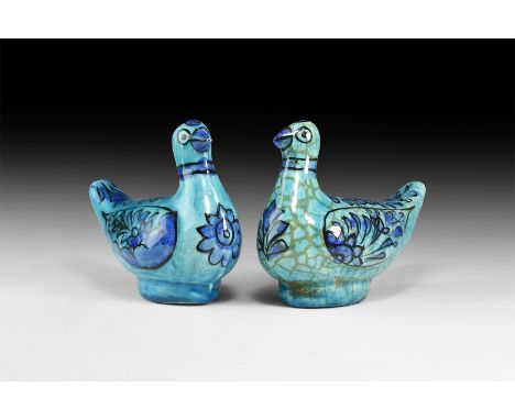 An undated archaistic group of blue-glazed ceramic dove figures with painted detailing.  900 grams total, 20cm (8"). Property