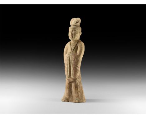 Tang Dynasty, 608-907 AD. A large ceramic statuette of a male court official, wearing cap with heart-shaped crest to top; lon