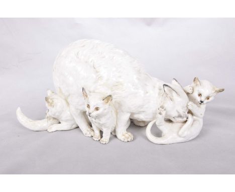 A very rare Royal Worcester cat and kitten group, circa 1875Modelled by James Hadley, modelled as a mother cat crouching with