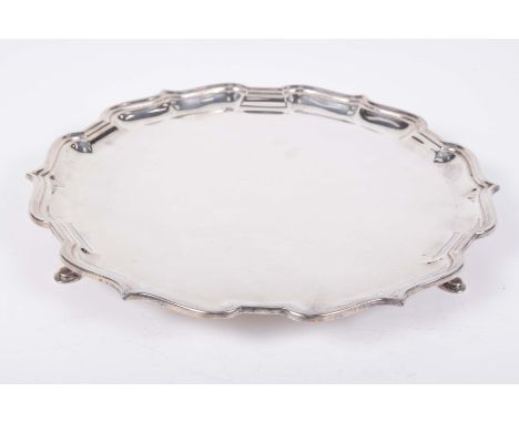 An Elizabeth II "Chippendale Revival" hallmarked silver salver by CJ Vander Ltd., and retailed by Boodle & DunthorneThe circu