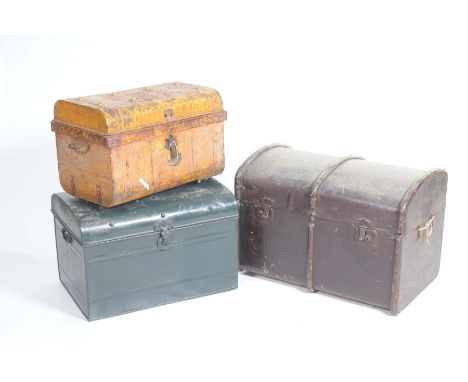 A Vintage domed canvas trunk and two domed metal trunksThe canvas trunk with a lined interior and two painted metal trunks wi