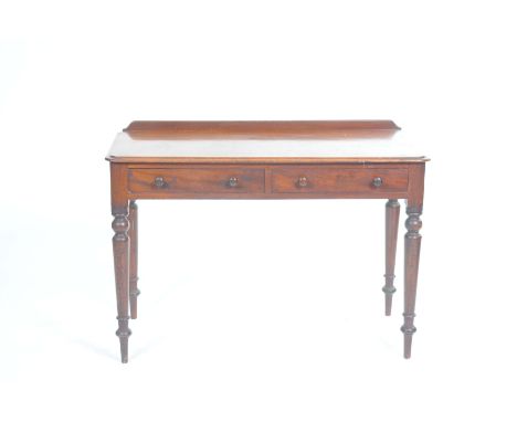 A Victorian mahogany side tableThe rectangular moulded top above two frieze drawers, each with turned button handles raised o