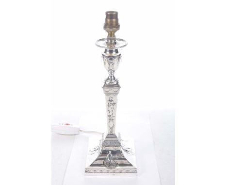 An Edwardian weighted hallmarked silver candlestick converted to an electric table lamp, London 1903/04Being in the neoclassi