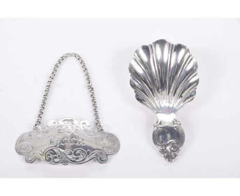 A Victorian hallmarked silver caddy spoon by Martin Hall & Co., Sheffield 1859/60Together with a Victorian hallmarked silver 