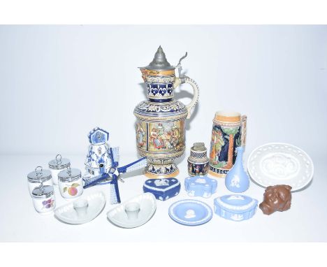 A large beer stein with pewter lid, 20th CenturyFurther smaller beer stein decorated with hunters, collection of Wedgwood blu