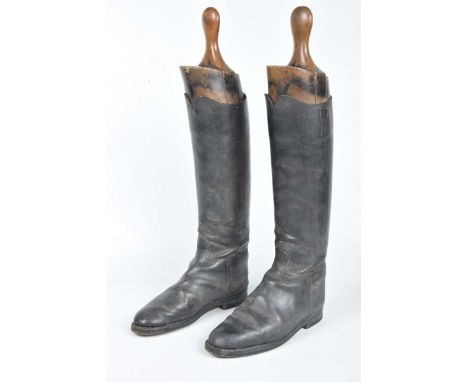 A pair of black leather hunting bootsComplete with wooden trees, with label Rowell & Sons Melton-Mowbray.