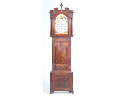 An 18th / 19th Century mahogany longcase clockWith a spherical finial above a swan-neck pediment and break arch rolling moon 