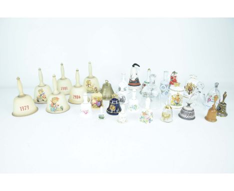 A collection of approximately thirty hand bells late 20th CenturyTo include Royal Aniversary bells by Aynsley, Goebel annual 