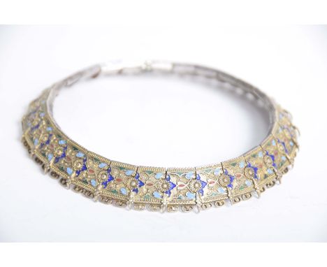A Russian silver and enamel collar neckletEach articulated panel with blue, green and red enamel detail, to a wirework rim, t