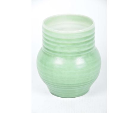 A Clarice Cliff vase, early 20th CenturyThe ring turned vase in green, base marked Clarice Cliff Wilkinson Limited England 56