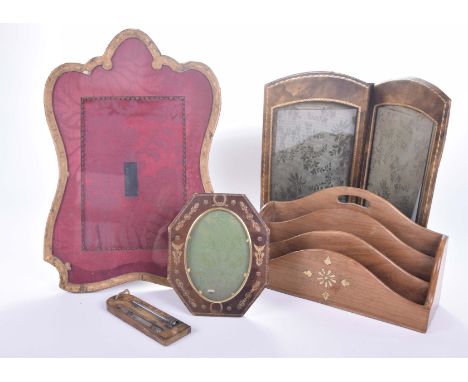 A collection of leather mounted photograph frames, mid 20th CenturyComprising easel framed glazed photo frame, further leathe
