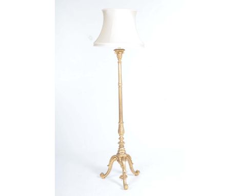 A fine 19th Century gilt wood lamp standardWith a fluted and Acanthus leaf carved shaft raised on three leaf carved downswept