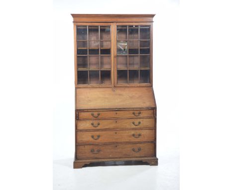 A 19th Century mahogany bureau bookcaseWith a moulded cornice above two glazed doors, each door with twelve panels enclosing 